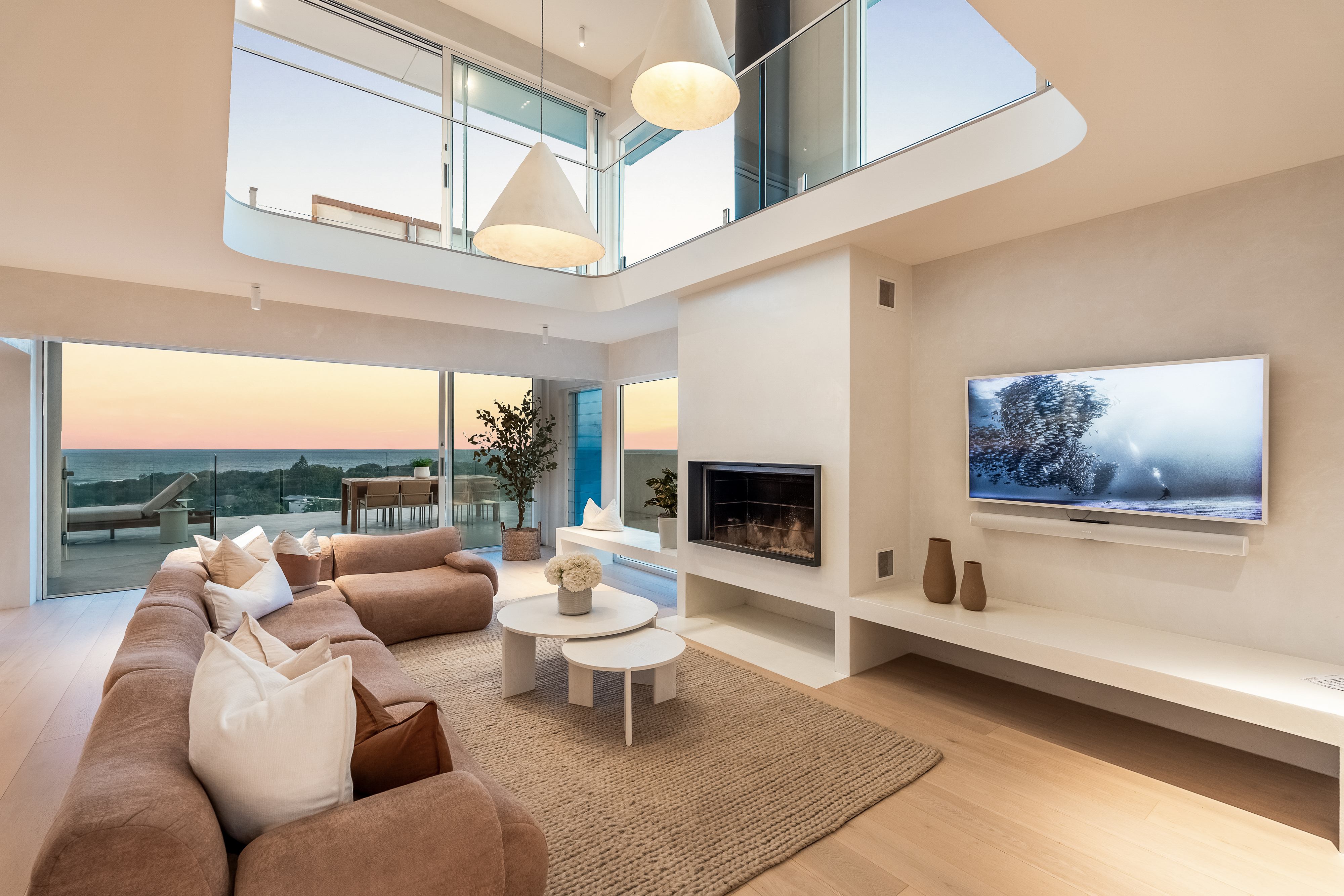 Pacific Vista living area at dusk — professional twilight real estate photography, Byron Bay