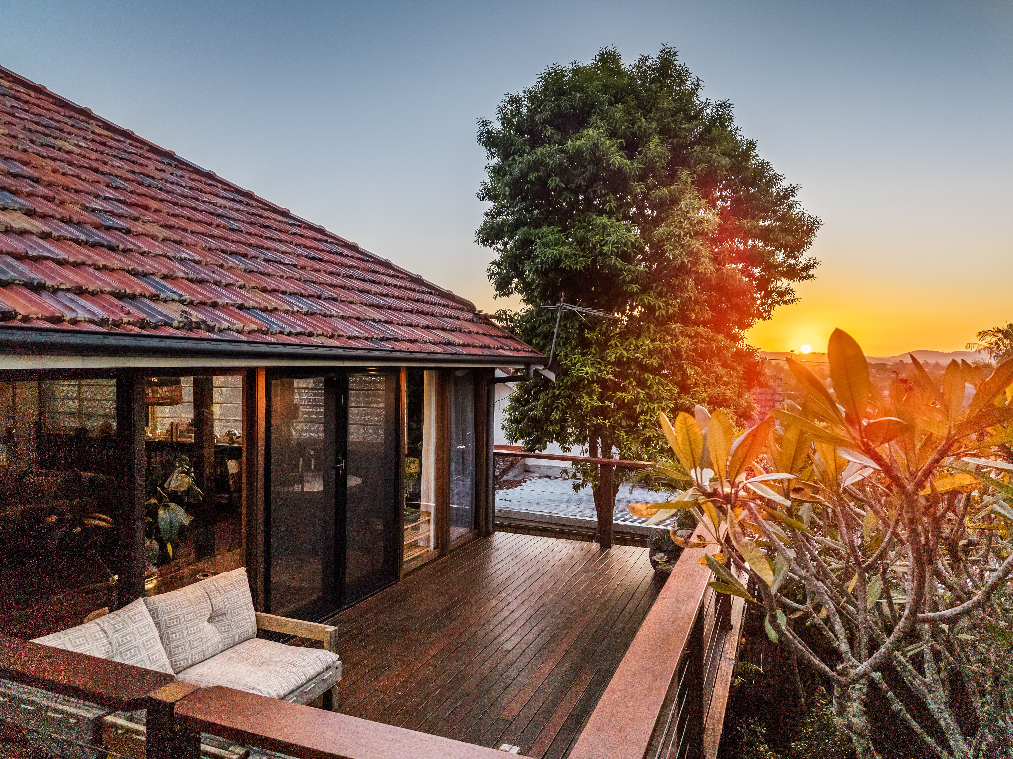 Drone shot of property and deck at sunset