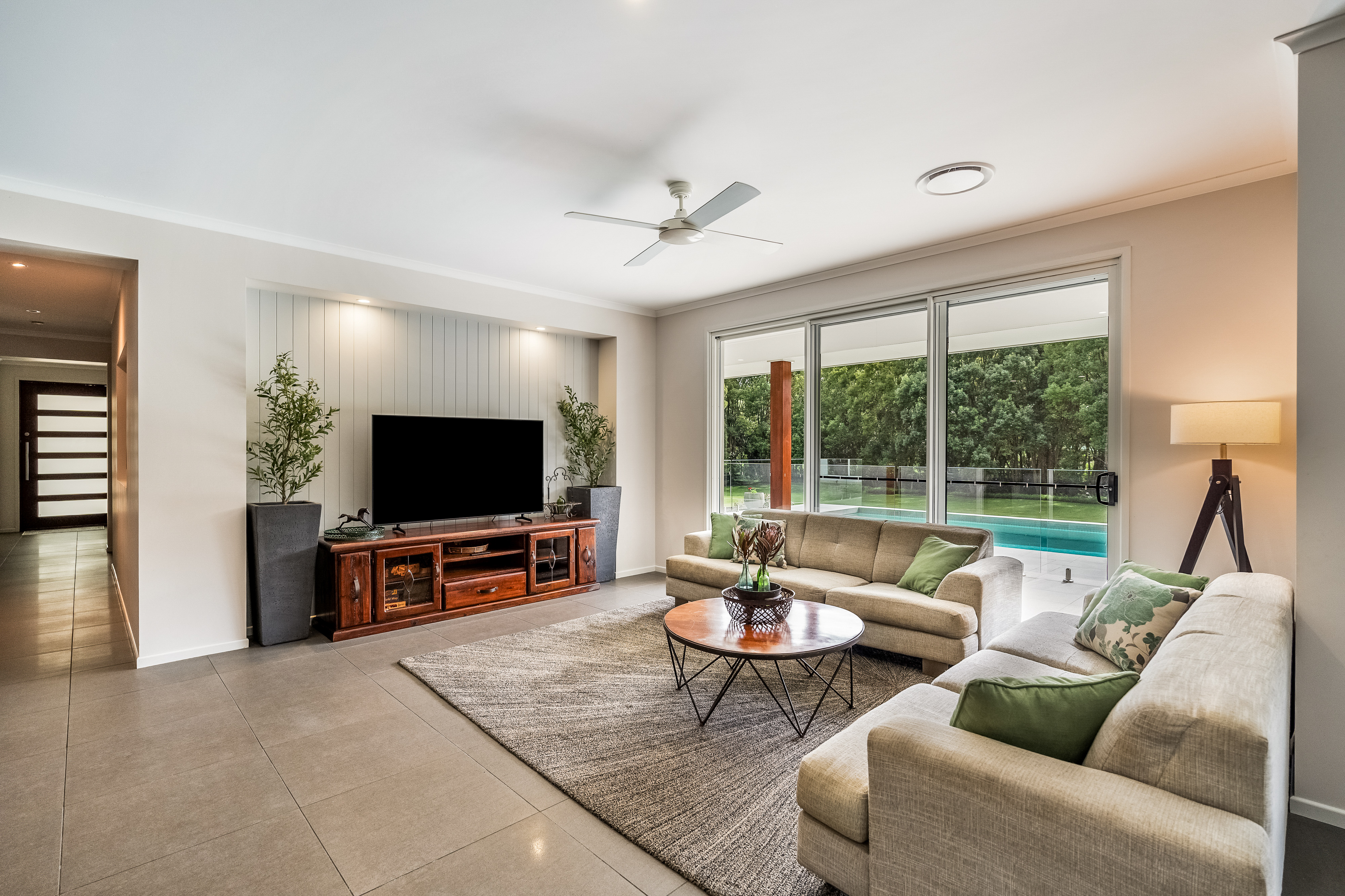 Living room with pool views — professional property photography Northern Rivers