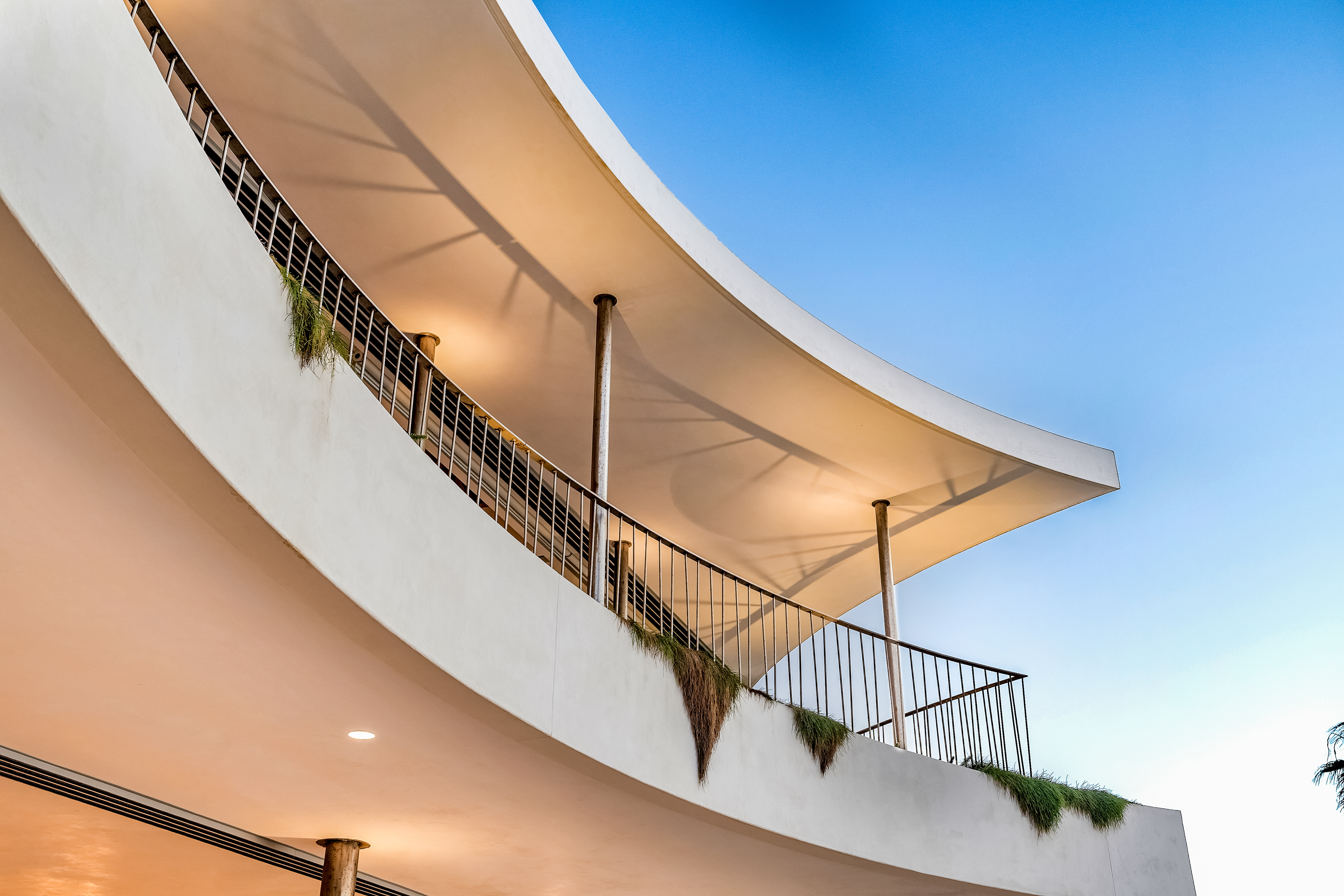 Architectural detail — the sweeping curved balconies and canopy at 'Coast', Byron Bay