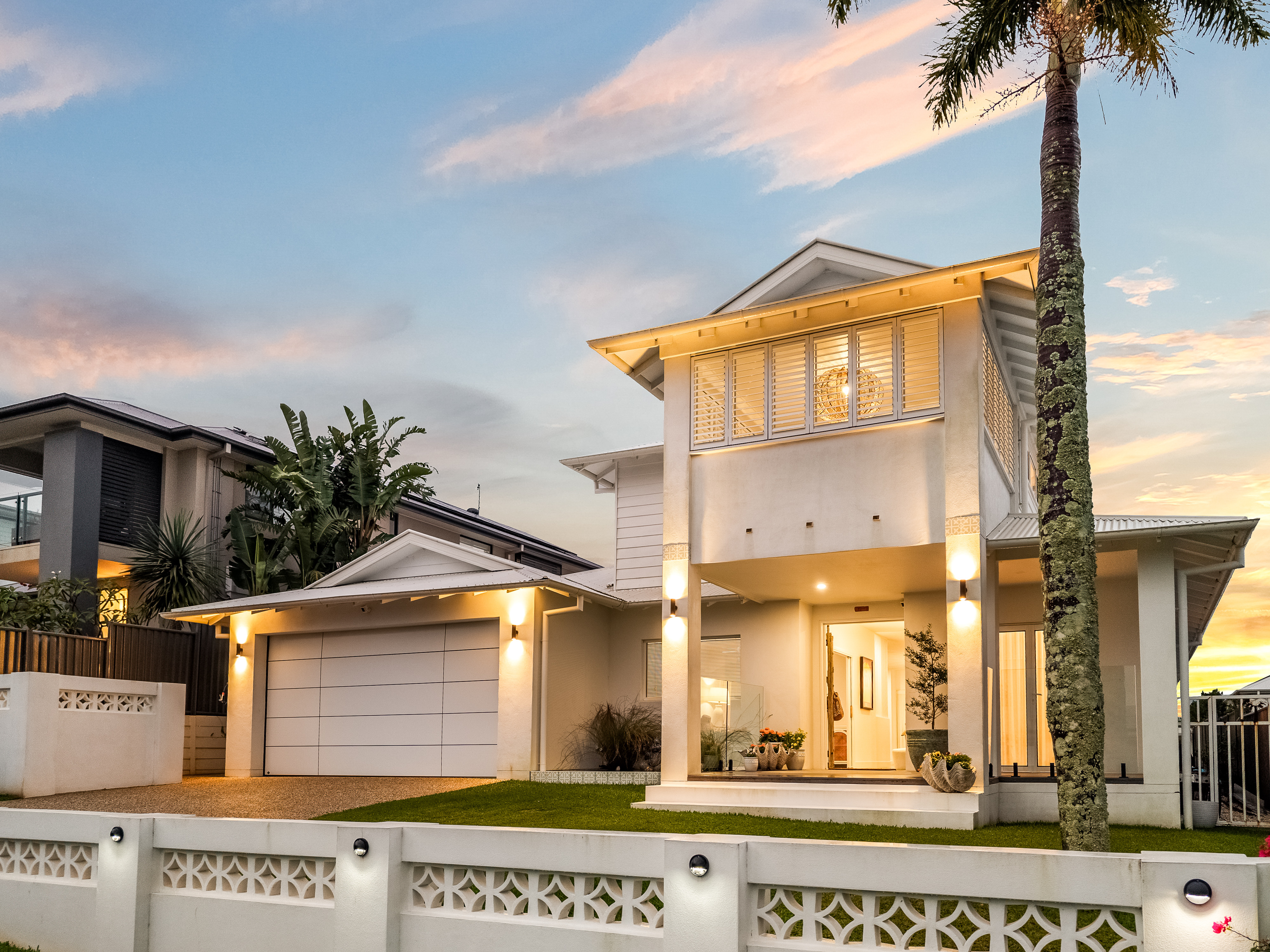 Twilight close-up — Hamptons facade with warm interior glow, real estate photographer Northern Rivers