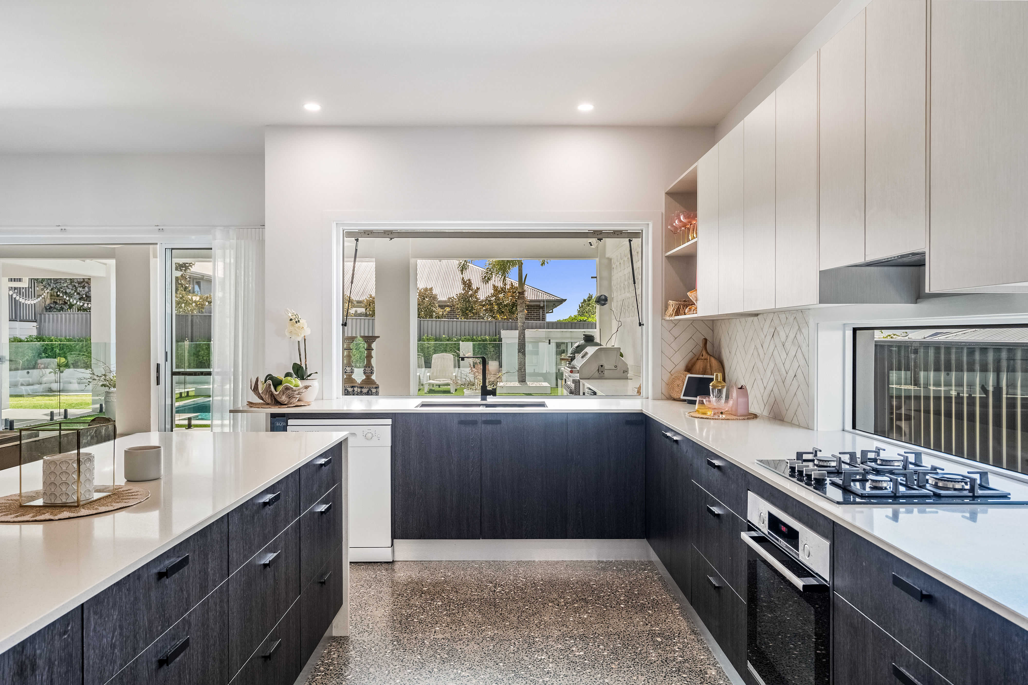 Kitchen with servery window to outdoor kitchen — real estate photography Northern Rivers