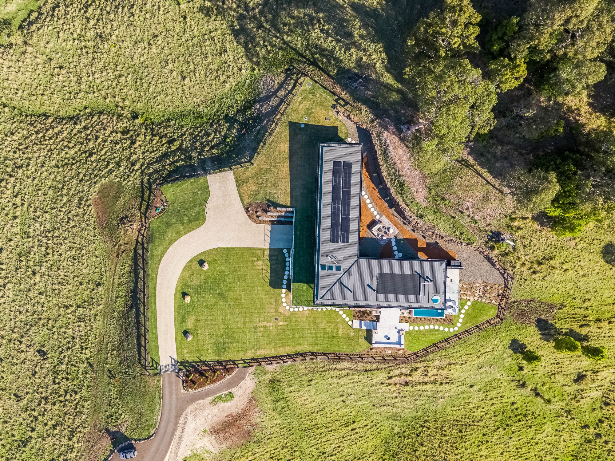 Nadir aerial showing home compound, solar panels and driveway