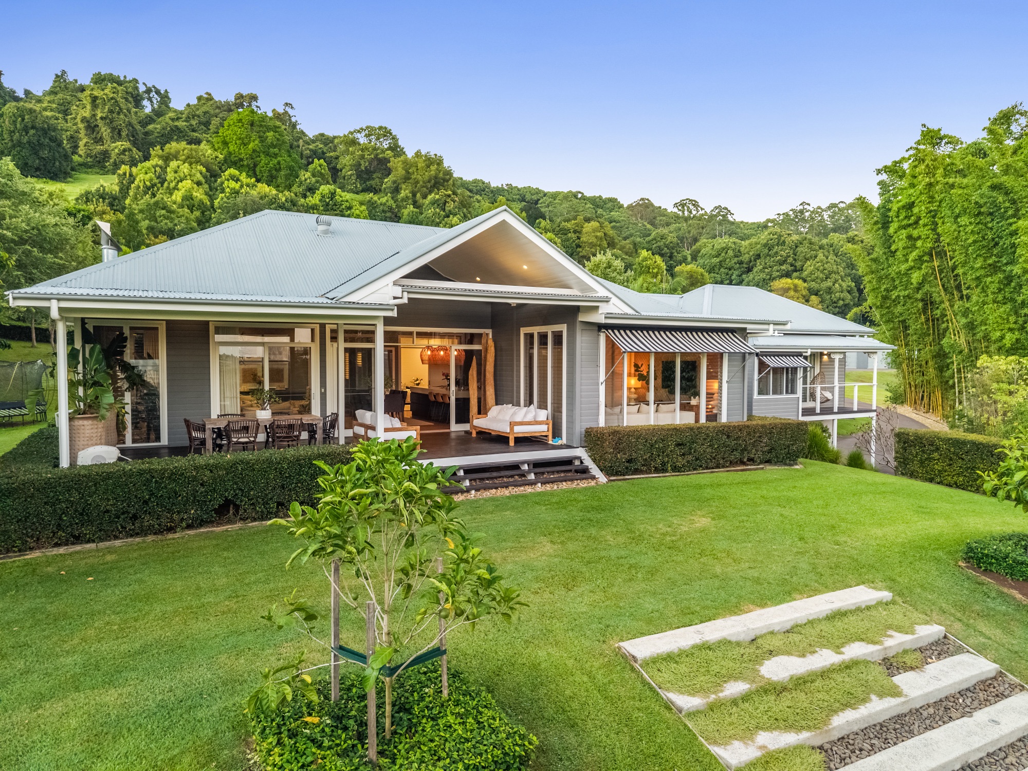 Low drone of front facade showing verandah, alfresco dining and entertainment deck