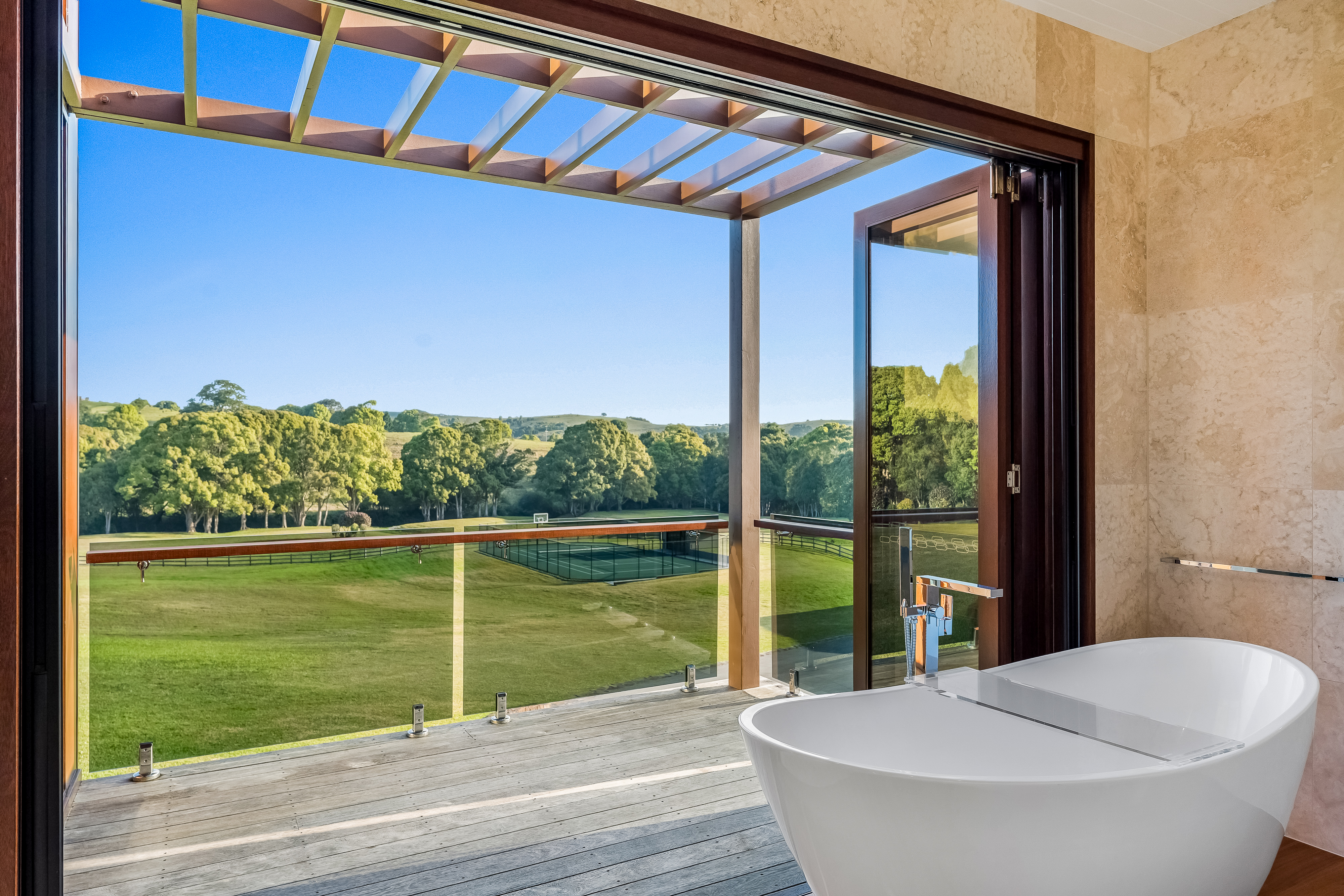 Freestanding bath with hinterland views — luxury property photography Byron Bay hinterland